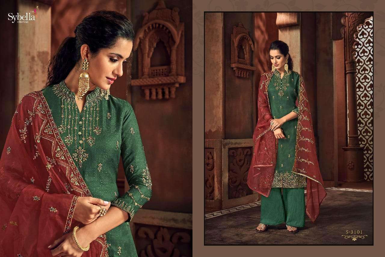 RIHANA NX BY SYBELLA 3101 TO 3105 SERIES BEAUTIFUL SUITS STYLISH FANCY COLORFUL PARTY WEAR & OCCASIONAL WEAR RASS SILK EMBROIDERED DRESSES AT WHOLESALE PRICE
