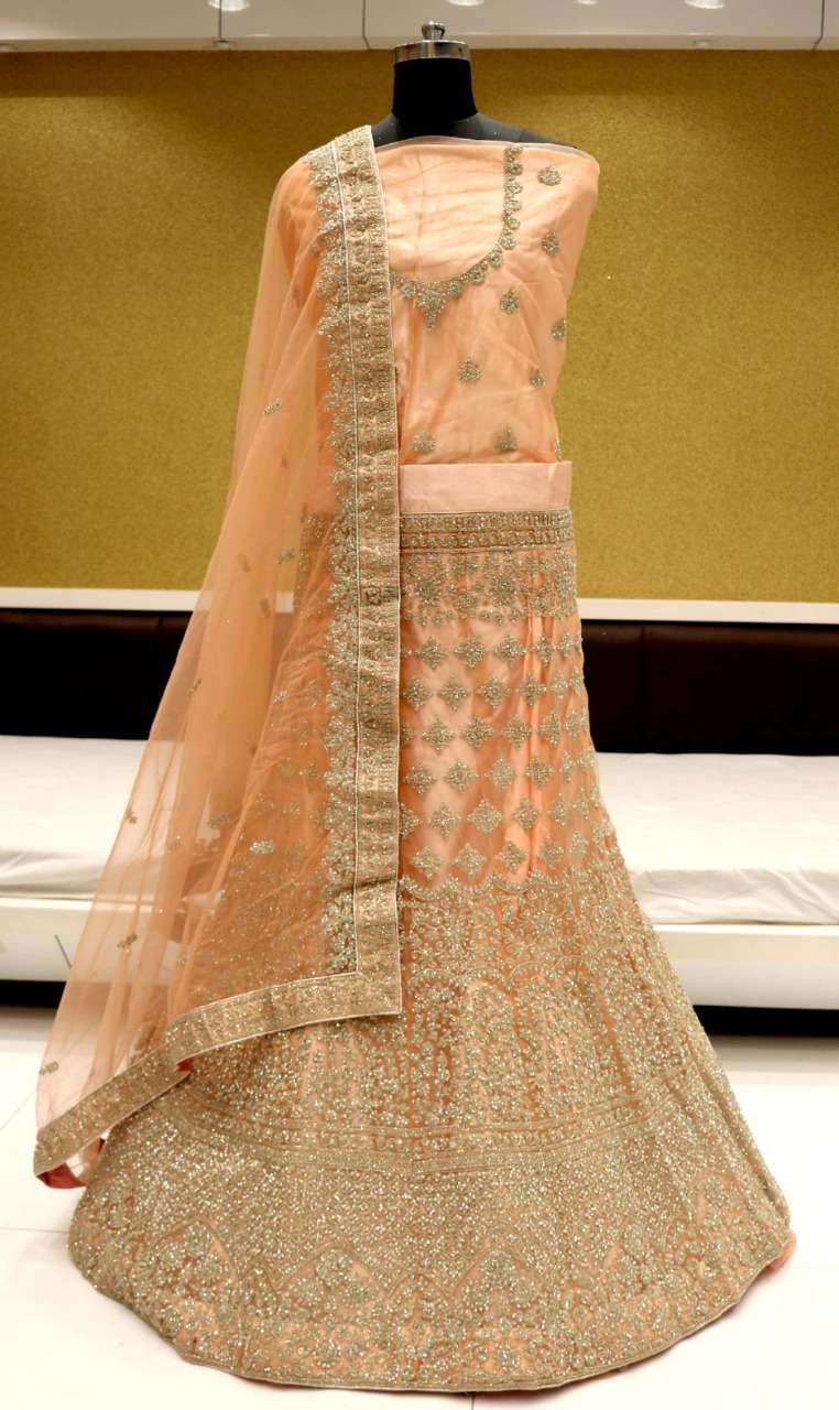 SPARK VOL-1 BY RIDDHOO FASHION 1001 TO 1004 SERIES BRIDAL WEAR COLLECTION BEAUTIFUL STYLISH COLORFUL FANCY PARTY WEAR & OCCASIONAL WEAR NET LEHENGAS AT WHOLESALE PRICE