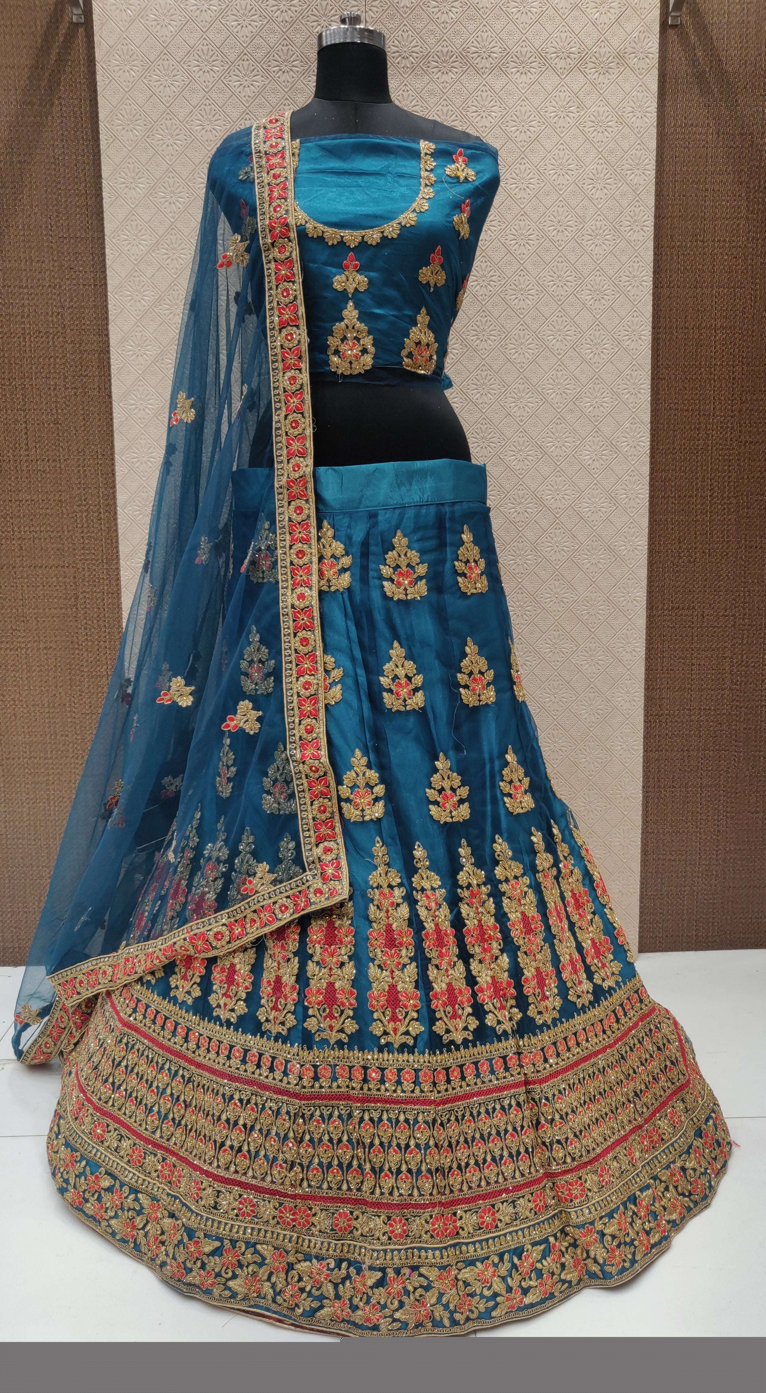RANGMANCH BY FASHID WHOLESALE 1001 TO 1004 SERIES INDIAN DESIGNER TRADITIONAL WEAR COLLECTION BEAUTIFUL STYLISH FANCY COLORFUL PARTY WEAR & OCCASIONAL WEAR NET LEHENGAS AT WHOLESALE PRICE