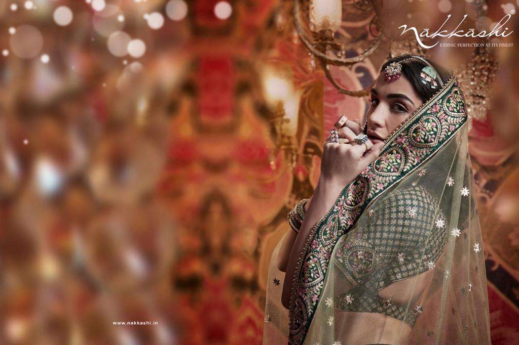 JASHN BY NAKKASHI 5173 TO 5183 SERIES BEAUTIFUL COLORFUL FANCY WEDDING COLLECTION OCCASIONAL WEAR & PARTY WEAR GREEN PURE RAW SILK LEHENGAS AT WHOLESALE PRICE