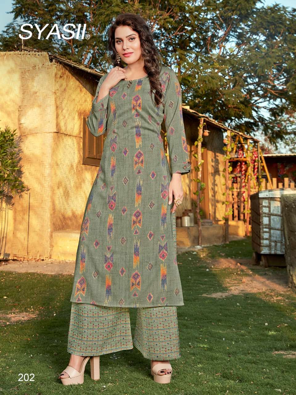 CULTURE VOL-2 BY SYASII 201 TO 204 SERIES DESIGNER STYLISH FANCY COLORFUL BEAUTIFUL PARTY WEAR & ETHNIC WEAR COLLECTION RAYON FOIL PRINT KURTIS WITH BOTTOM AT WHOLESALE PRICE
