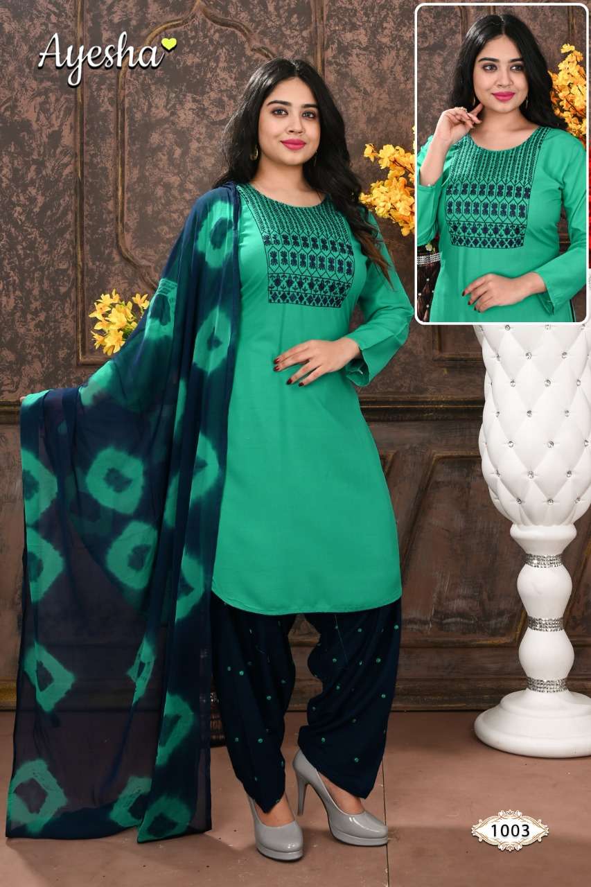 NIKKI VOL-1 BY AYESHA 1001 TO 1008 SERIES BEAUTIFUL STYLISH SHARARA SUITS FANCY COLORFUL CASUAL WEAR & ETHNIC WEAR & READY TO WEAR RAYON EMBROIDERED DRESSES AT WHOLESALE PRICE