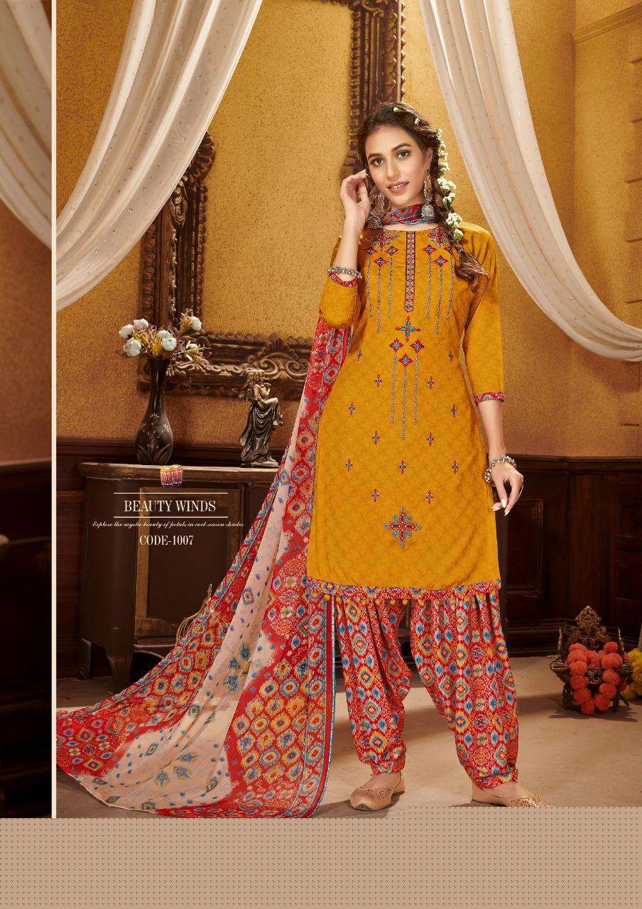 KUDI PATOLA BY ROLI MOLI 1001 TO 1008 SERIES BEAUTIFUL SUITS COLORFUL STYLISH FANCY CASUAL WEAR & ETHNIC WEAR COTTON NAGITIVE PRINT WITH EMBROIDERY WORK DRESSES AT WHOLESALE PRICE