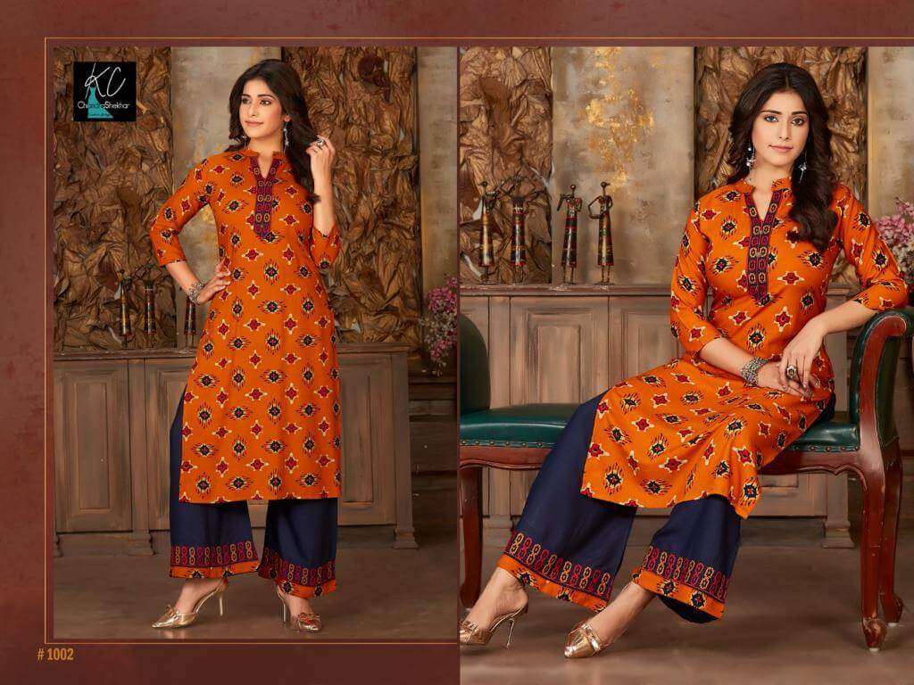 NOOR VOL-14 BY KC 1001 TO 1008 SERIES BEAUTIFUL STYLISH FANCY COLORFUL CASUAL WEAR & ETHNIC WEAR & READY TO WEAR RAYON PRINTED KURTIS WITH BOTTOM AT WHOLESALE PRICE
