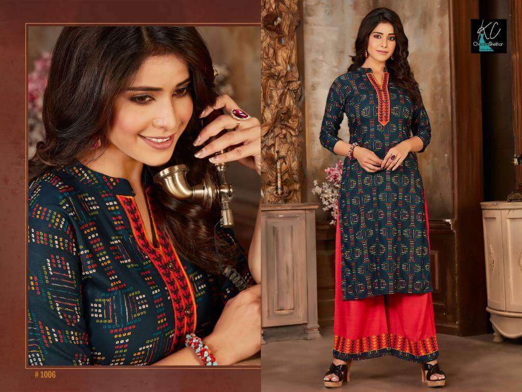 NOOR VOL-14 BY KC 1001 TO 1008 SERIES BEAUTIFUL STYLISH FANCY COLORFUL CASUAL WEAR & ETHNIC WEAR & READY TO WEAR RAYON PRINTED KURTIS WITH BOTTOM AT WHOLESALE PRICE