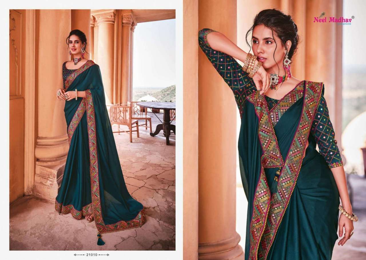 MIRISHA BY NEEL MADHAV 21001 TO 21015 SERIES INDIAN TRADITIONAL WEAR COLLECTION BEAUTIFUL STYLISH FANCY COLORFUL PARTY WEAR & OCCASIONAL WEAR FANCY SAREES AT WHOLESALE PRICE