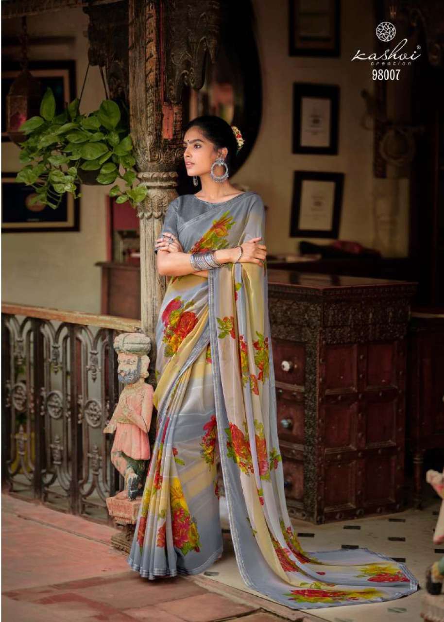 JANKI BY KASHVI CREATION 98001 TO 98010 SERIES INDIAN TRADITIONAL WEAR COLLECTION BEAUTIFUL STYLISH FANCY COLORFUL PARTY WEAR & OCCASIONAL WEAR CHIFFON SAREES AT WHOLESALE PRICE