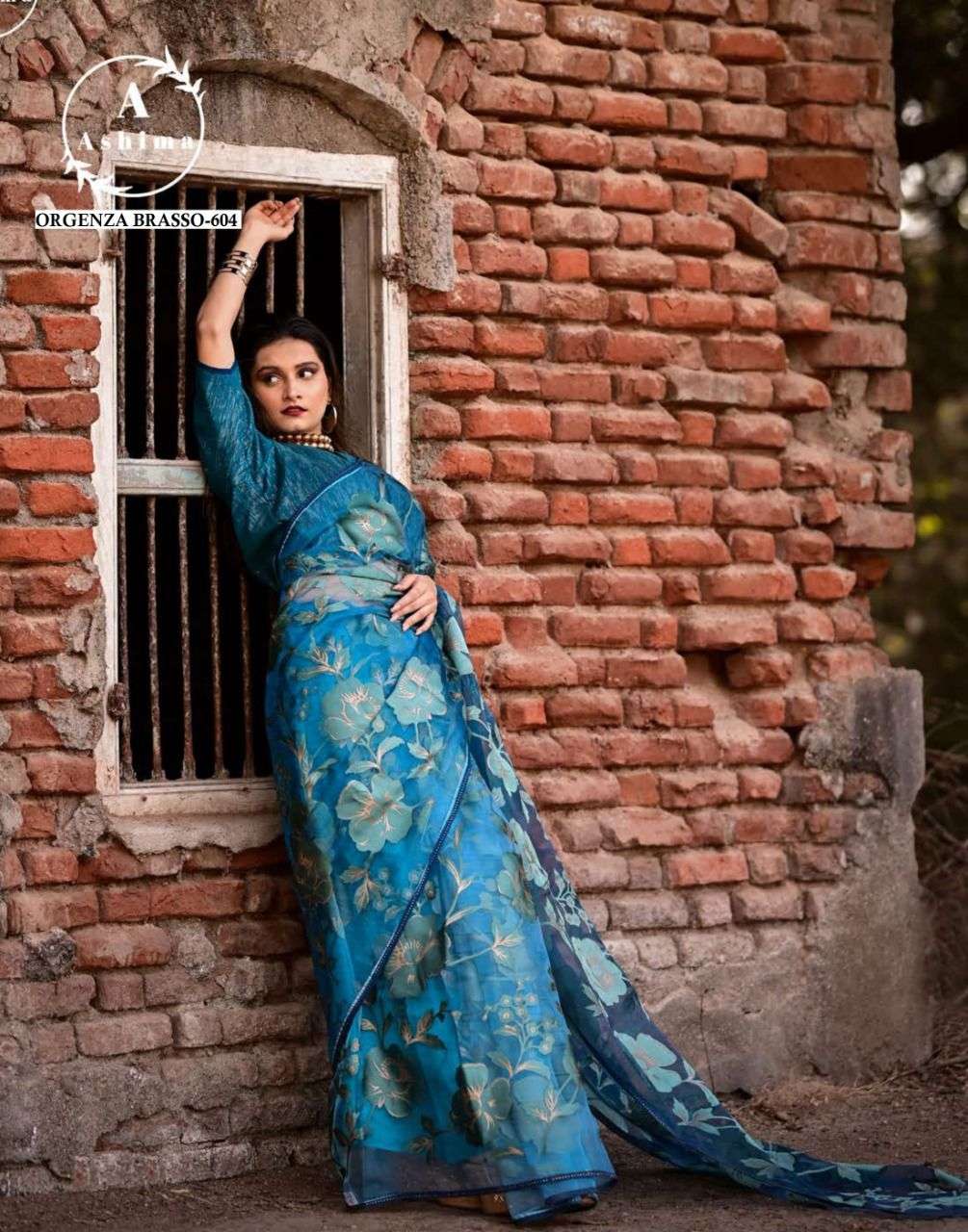 ORGANZA BRASSO BY ASHIMA 601 TO 608 SERIES INDIAN TRADITIONAL WEAR COLLECTION BEAUTIFUL STYLISH FANCY COLORFUL PARTY WEAR & OCCASIONAL WEAR ORGANZA BRASSO SAREES AT WHOLESALE PRICE