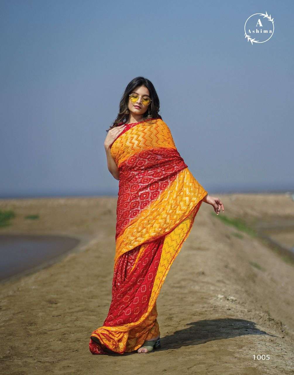 BANDHANI FOILY BY ASHIMA 1001 TO 1008 SERIES INDIAN TRADITIONAL WEAR COLLECTION BEAUTIFUL STYLISH FANCY COLORFUL PARTY WEAR & OCCASIONAL WEAR MOSS FOIL SAREES AT WHOLESALE PRICE