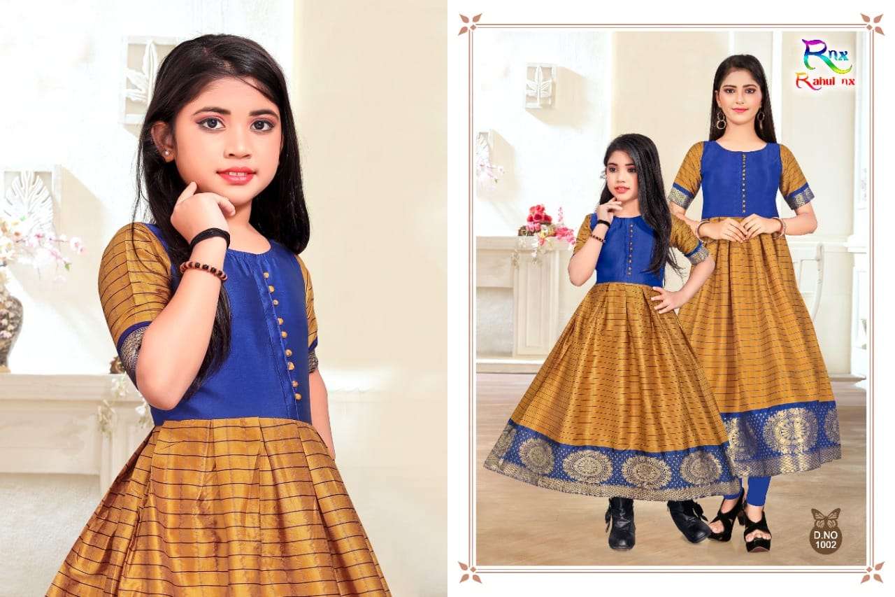 KIDSWEAR BY RAHUL NX 1001 TO 1006 SERIES BEAUTIFUL BEAUTIFUL STYLISH FANCY COLORFUL CASUAL WEAR & ETHNIC WEAR READY TO WEAR BANARASI SILK JACQUARD GOWNS AT WHOLESALE PRICE