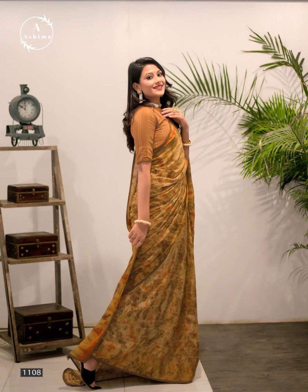 AJRAKH PRISM BY ASHIMA 1101 TO 1108 SERIES INDIAN TRADITIONAL WEAR COLLECTION BEAUTIFUL STYLISH FANCY COLORFUL PARTY WEAR & OCCASIONAL WEAR GEORGETTE PRINT SAREES AT WHOLESALE PRICE