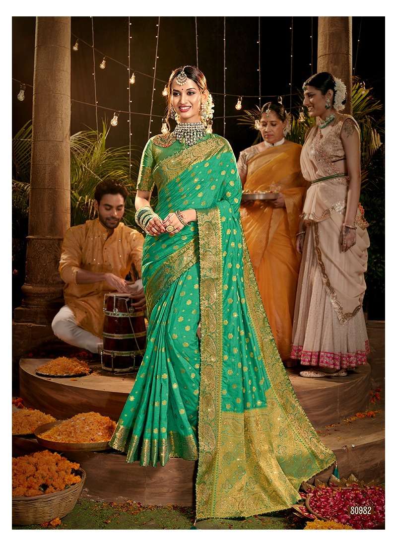 MEHNDI KE RANG BY LIFESTYLE 80981 TO 80986 SERIES INDIAN TRADITIONAL WEAR COLLECTION BEAUTIFUL STYLISH FANCY COLORFUL PARTY WEAR & OCCASIONAL WEAR NYLON DOLA SAREES AT WHOLESALE PRICE