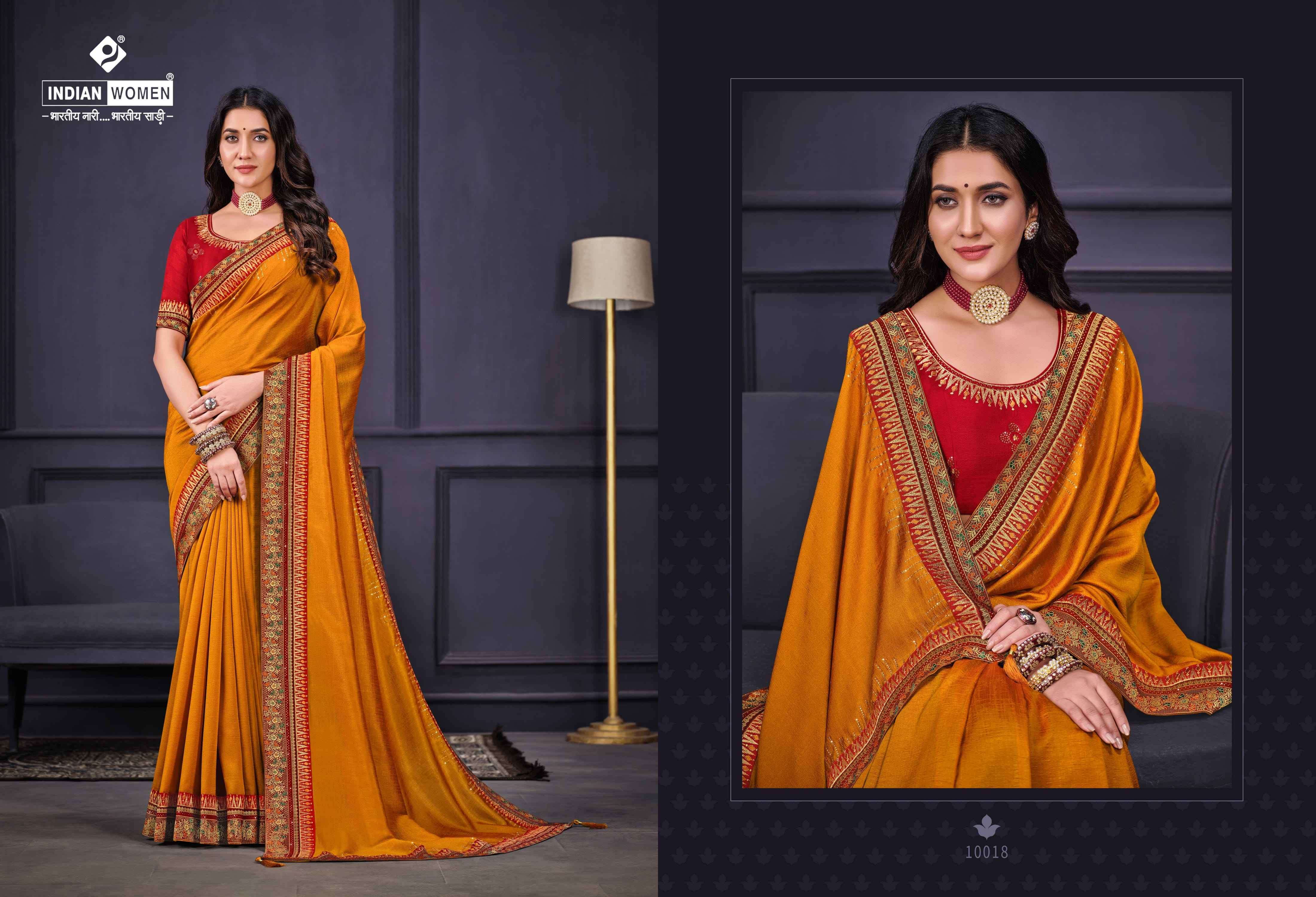 NEW ORANGE BY INDIAN WOMEN 10017 TO 10022 SERIES INDIAN TRADITIONAL WEAR COLLECTION BEAUTIFUL STYLISH FANCY COLORFUL PARTY WEAR & OCCASIONAL WEAR FANCY SAREES AT WHOLESALE PRICE