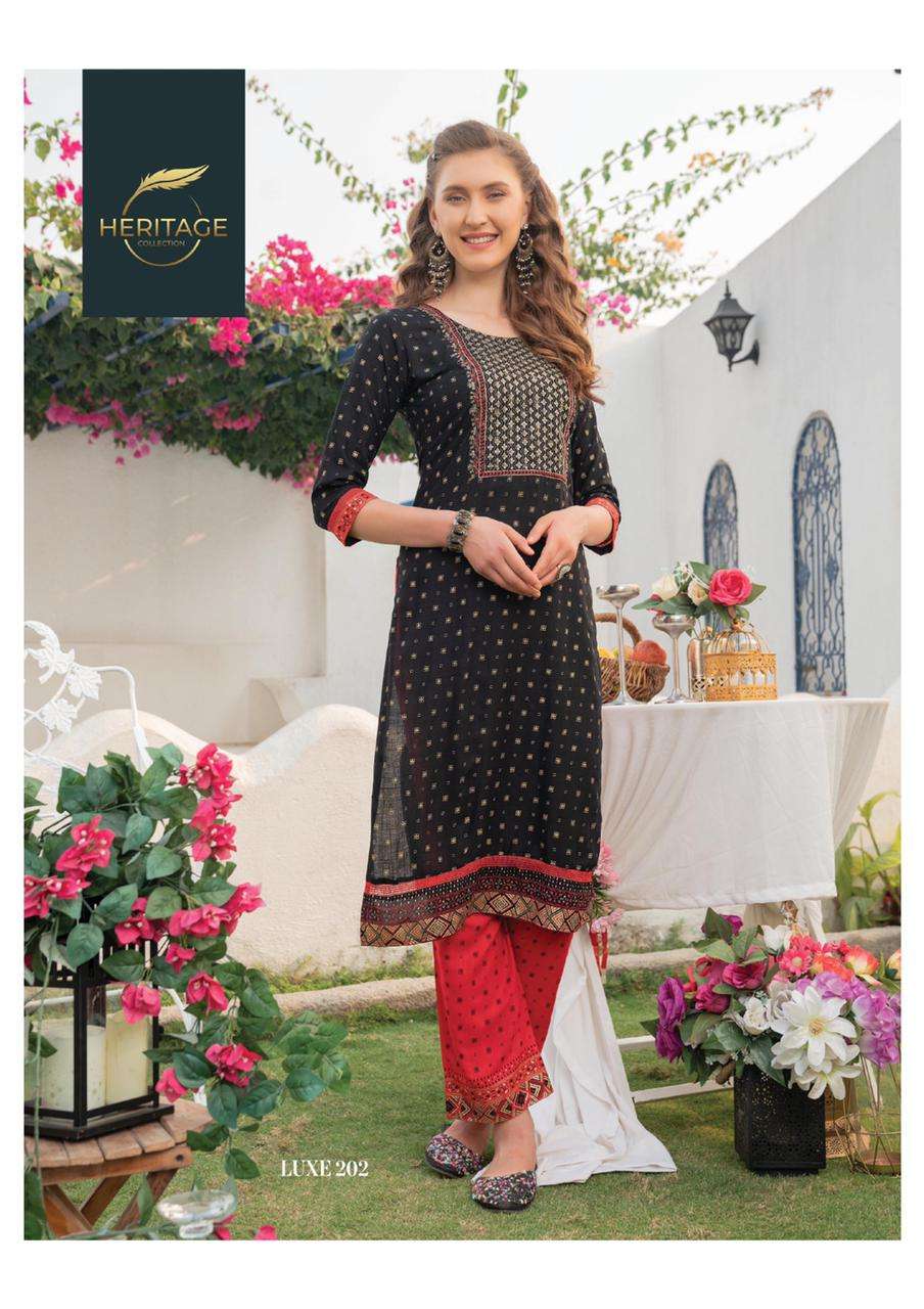 LUXE VOl-2 BY HERITAGE 201 TO 206 SERIES DESIGNER STYLISH FANCY COLORFUL BEAUTIFUL PARTY WEAR & ETHNIC WEAR COLLECTION RAYON KURTIS WITH BOTTOM AT WHOLESALE PRICE