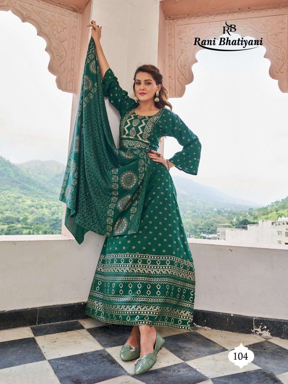 STUDIO BY RANI BHATIYANI 101 TO 108 SERIES BEAUTIFUL STYLISH FANCY COLORFUL CASUAL WEAR & ETHNIC WEAR RAYON FOIL PRINT GOWNS WITH DUPATTA AT WHOLESALE PRICE